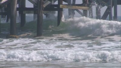 901336228-timber-pole-daytona-beach-pier-breaking-wave