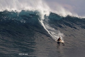 A man surfing on a large wave